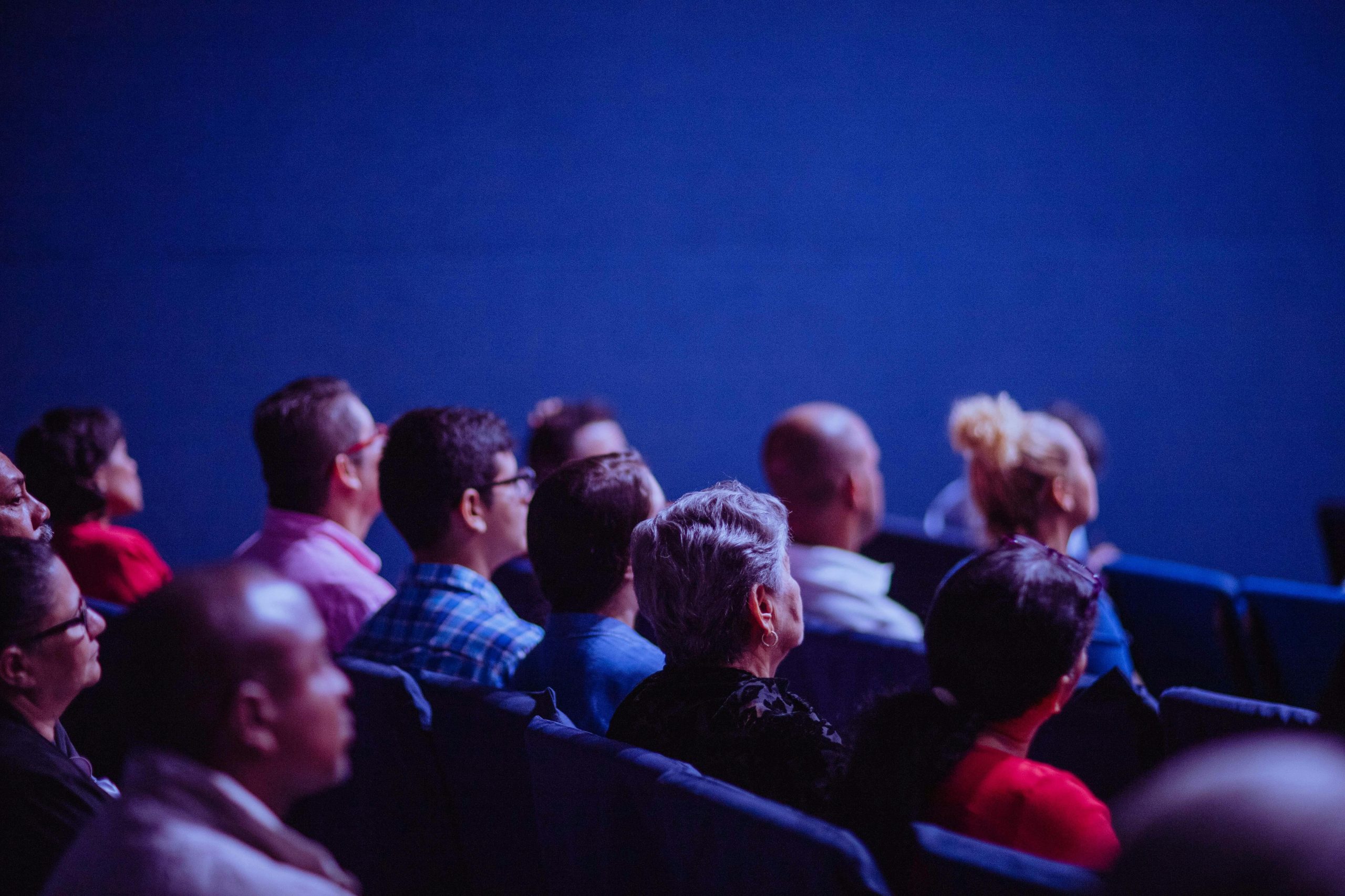 people sitting a Gang chair having an online conference